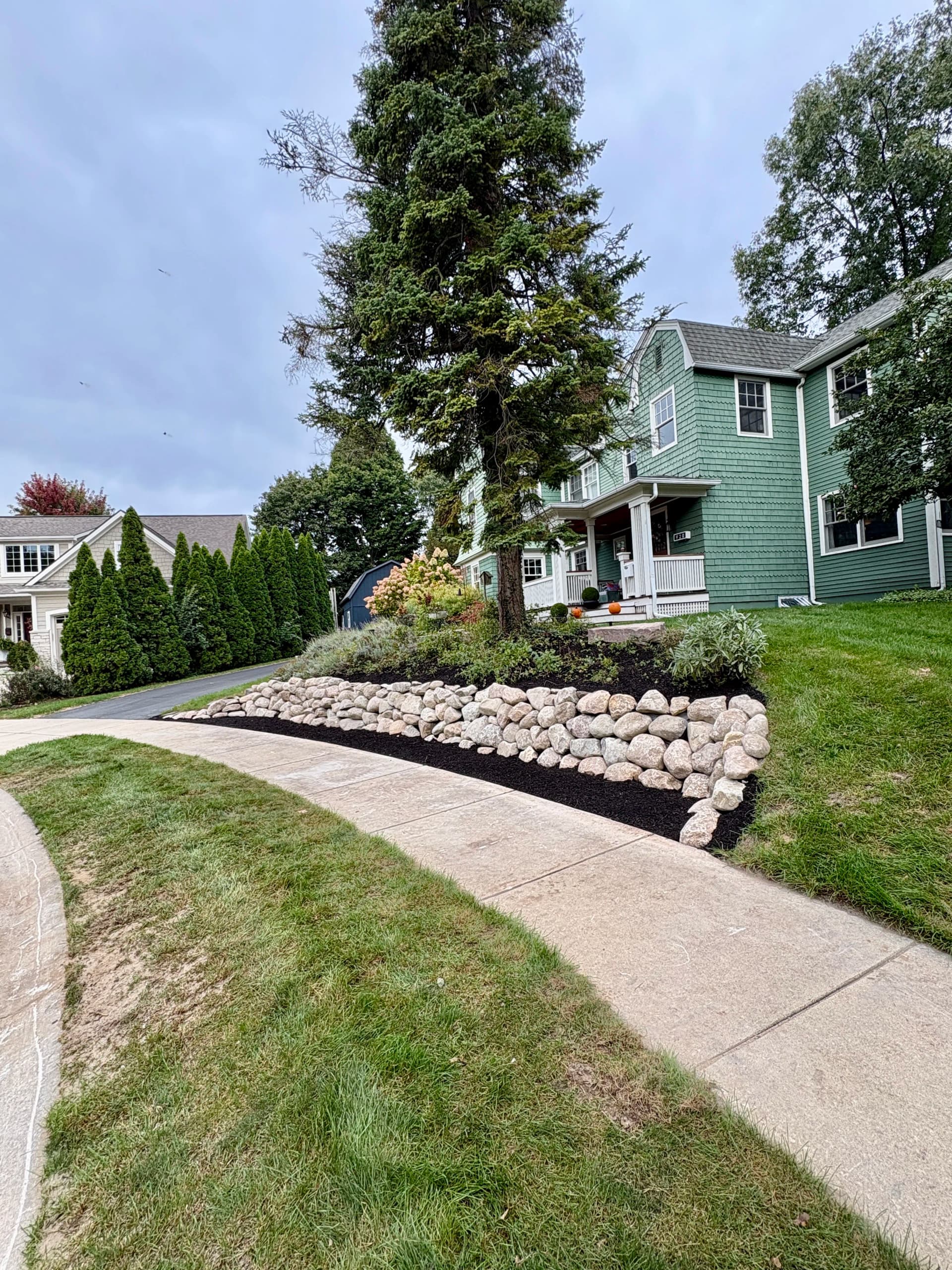 Boulder Retaining Wall and Slope Redesign in Northville image