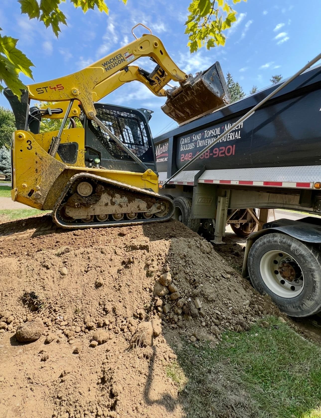 Hauling Hundreds of Yards of Dirt for a Novi Builder image